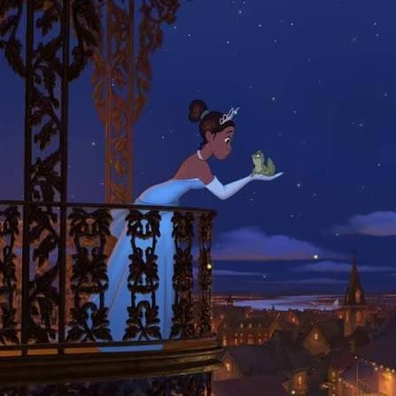 Tiana leaning over a balcony at night, face to face with Naveen as a frog, city lights glowing below